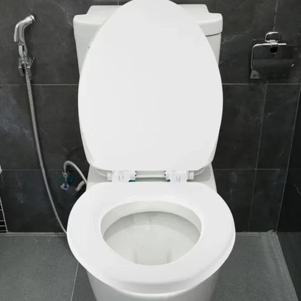 Soft-close elongated toilet seat with slow-closing hinge mechanism