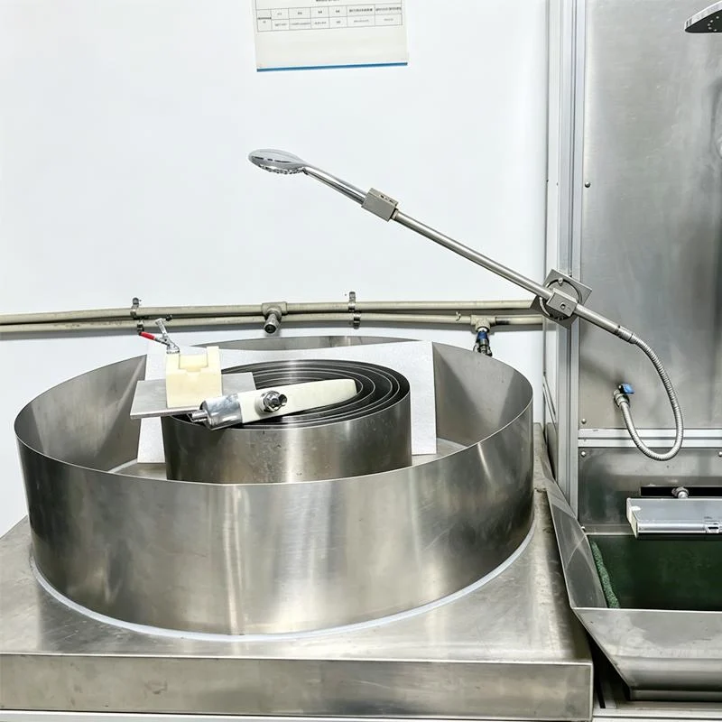 Handheld shower head mounted on hose bending durability test machine in JEKARE quality lab