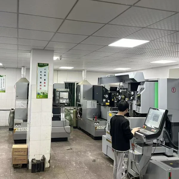 Workshop interior with multiple AQ360 wire‑cut EDM machines