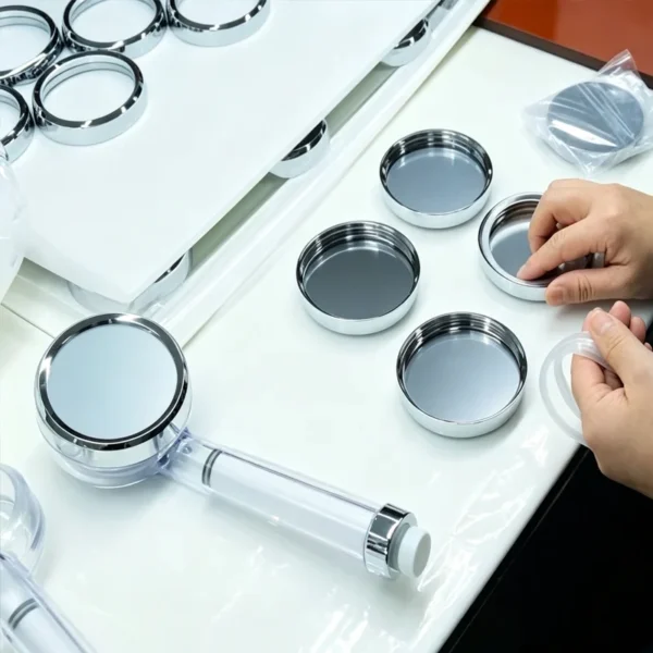 Jekare workers assembling handheld shower head components