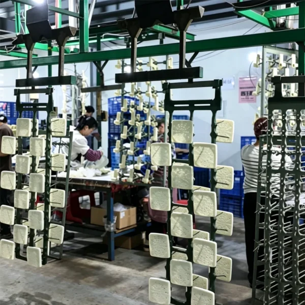 Jekare bathroom accessory components on the production line after injection molding
