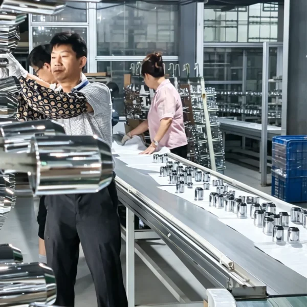 Jekare workers polishing and inspecting shower head components on the production line