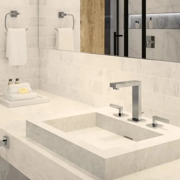 Modern bathroom vanity with chrome faucet and marble vessel sink