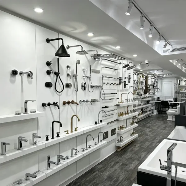 Showroom display wall with wide selection of modern faucets, shower systems and bathroom accessories