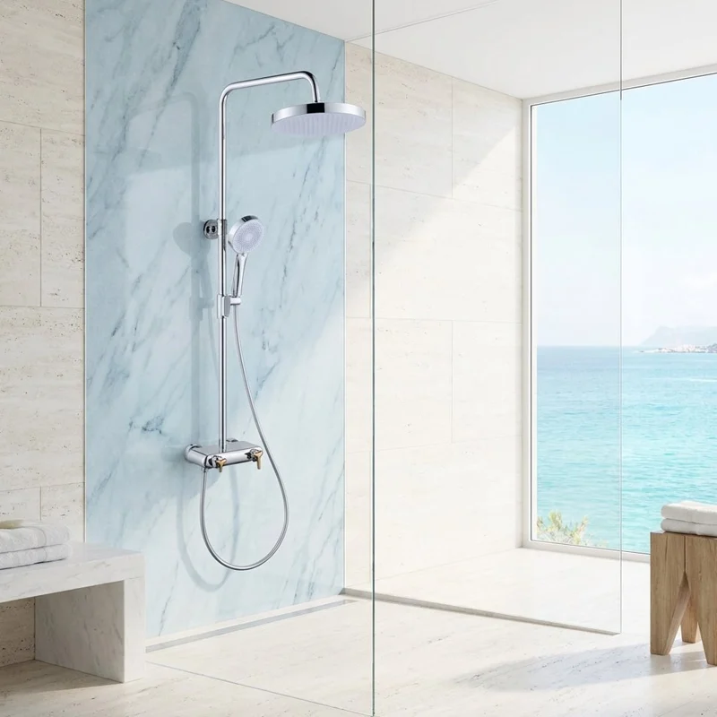 Chrome shower column installed against a marble wall shower
