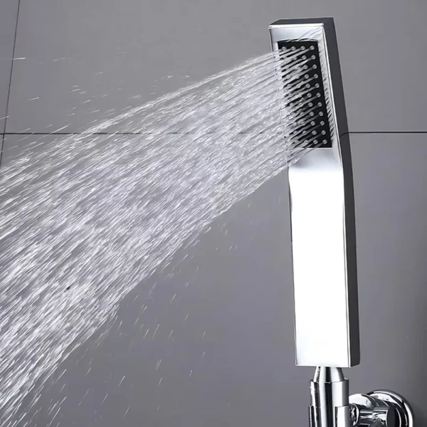 Square chrome handheld shower head showing powerful water spray output