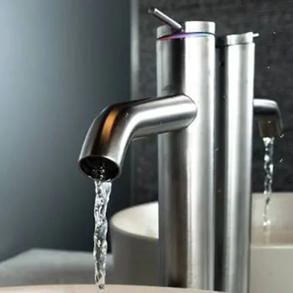 Brushed stainless steel bathroom faucet with running water flow